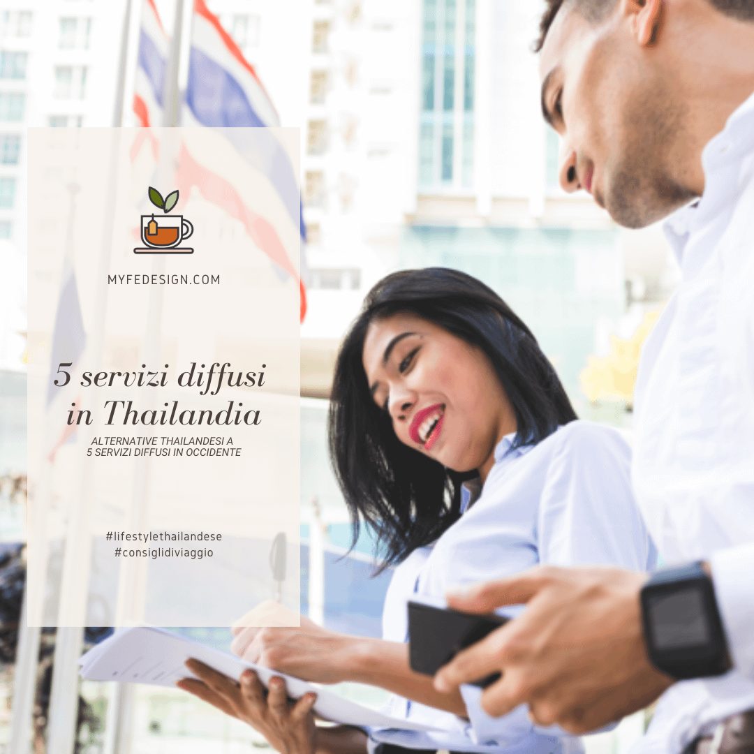Donna e uomo che guardano lo smartphone con la bandiera thailandese sullo sfondo