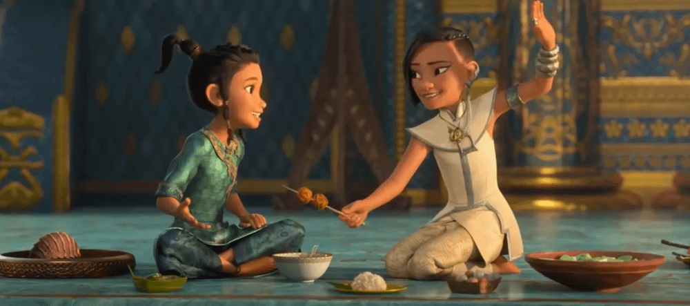 Scena dal cartone in cui le piccole Raya e Namaari fanno amicizia mangiando insieme