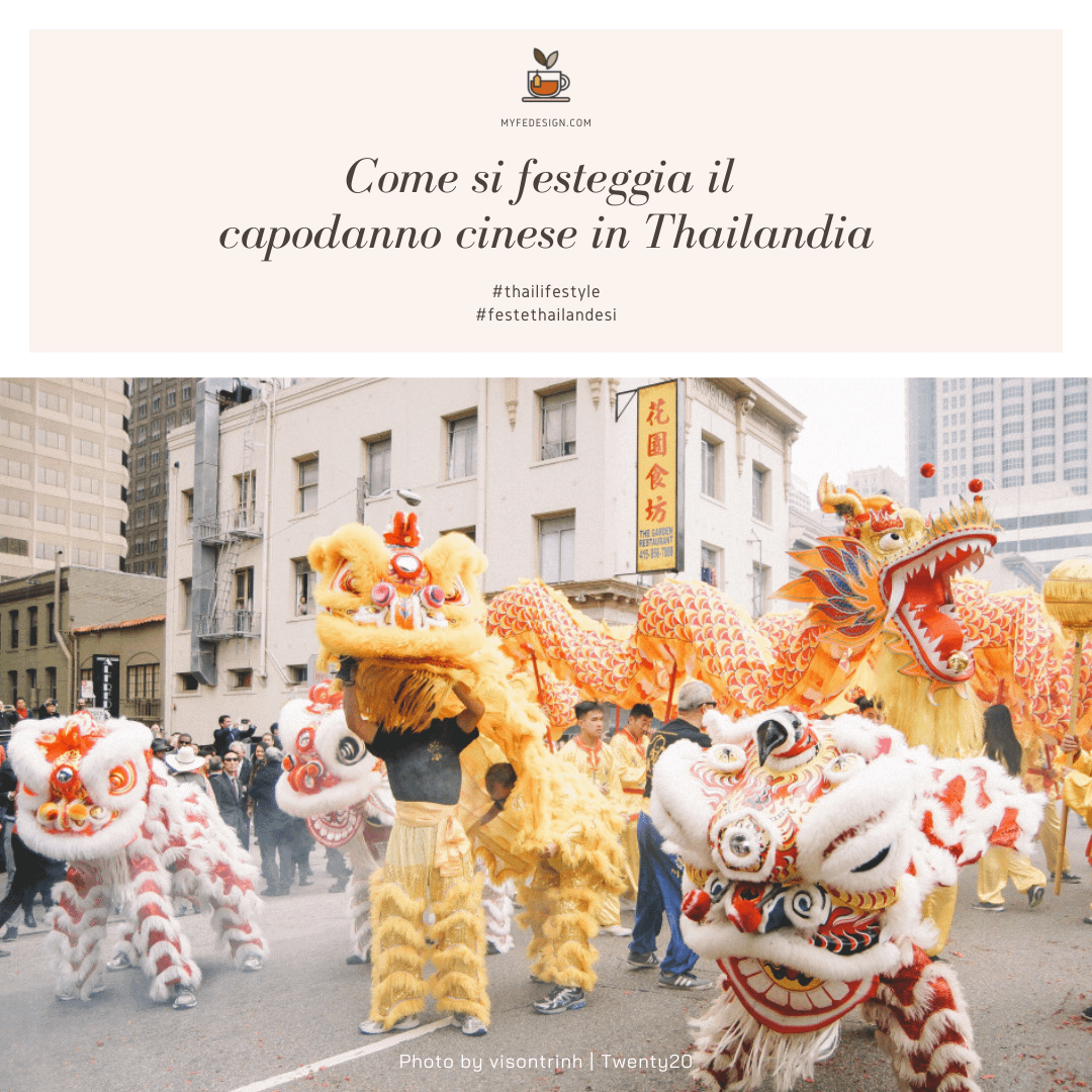 Strada asiatica con persone in costume da drago per i festeggiamenti per il capodanno cinese